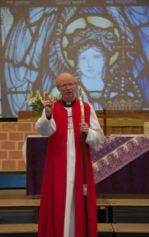 A photo of Bishop James Langstaff as he blesses and inaugurates St Gabriel's Church, Kings Hill