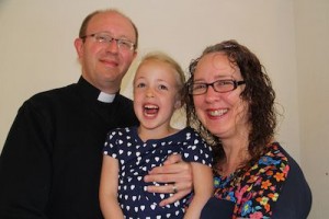 A photo of Mark Montgomery with his wife Kirsty and daughter.